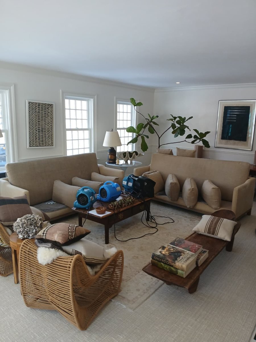 Sectional sofa drying under an air mover after cleaning